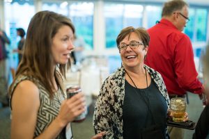 Two woman talking and smiling