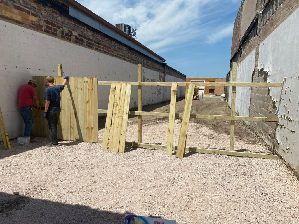 Iowa Akron vacant lot new fence