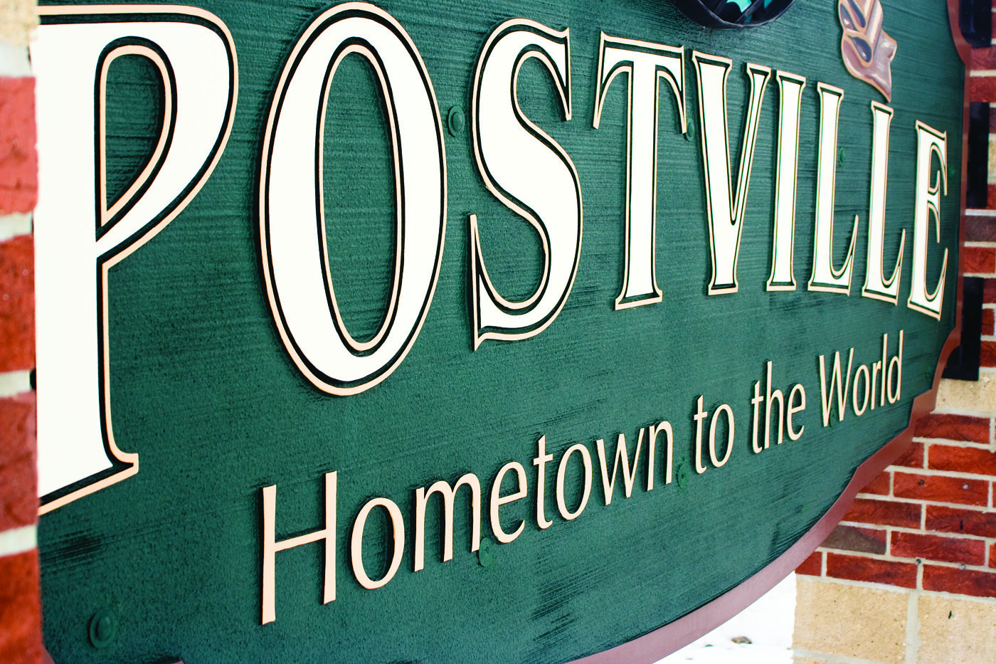 Potsville Iowa, town sign with ostville’s tagline is Hometown to the World