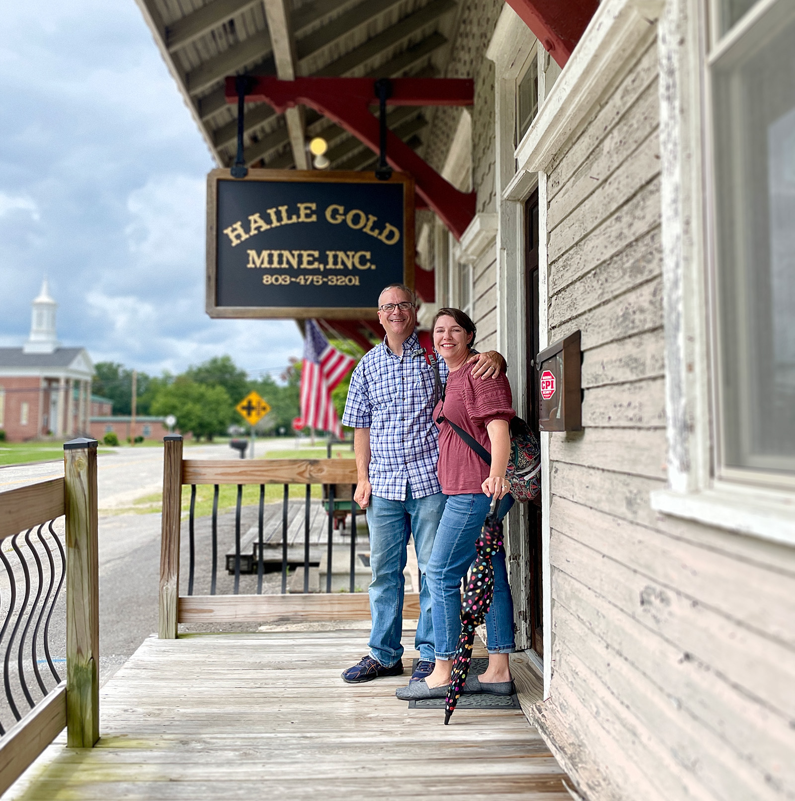 Scott and Tiffany Whaley stop for a picture in front of the old Kershaw Train Depot renewed as office spaces and a museum.