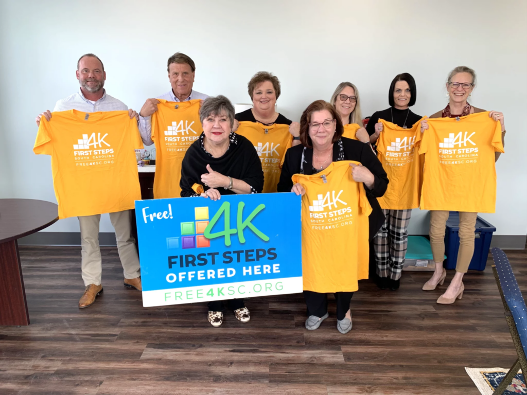 Susan DeVenny, President and CEO of the Arras Foundation (far-right, back row) stands with town officials in Kershaw, including Town Administrator, Ryan McLemore (back row, from left to right); Kershaw Mayor Mark Dorman; Clyburn Early Childhood Center First Steps 4K Director Tonya Hunter; Lancaster County First Steps Board Member Anna Henson; and, Lancaster County First Steps Office Manager Leslie Sinclair; as well as South Carolina First Steps State Leaders Martha Strickland and Kristine Jenkins (front row, left to right).
Photo courtesy of the Arras Foundation.