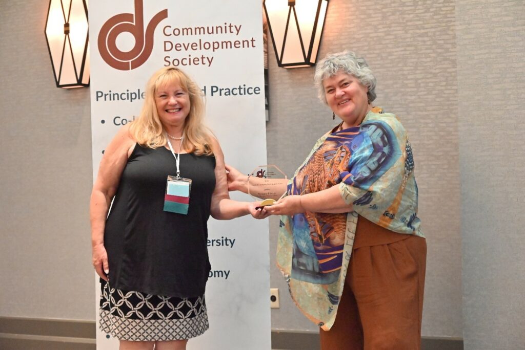 Photo: Leanne Tingay receives Friend of Community Development Award from the Community Development Society. Credit: Community Development Society