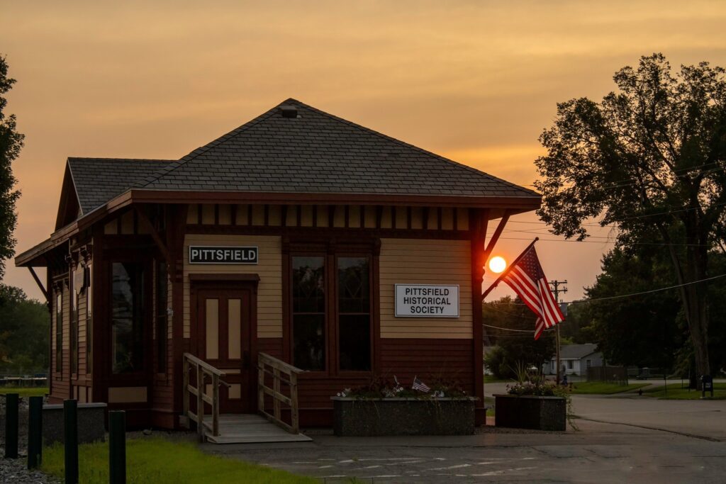Image of Pittsfield Maine's Historical Society Building during sunset