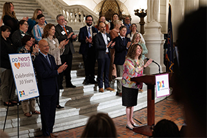 Image of PA Humanities executive director Laurie Zierer welcoming people to a special celebration of 10 years of PA Heart & Soul at the Capitol Rotunda in Harrisburg.
