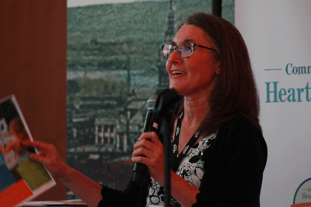 Community Heart & Soul Vice President of Programs, Sara Lightner addresses guests at the celebration.